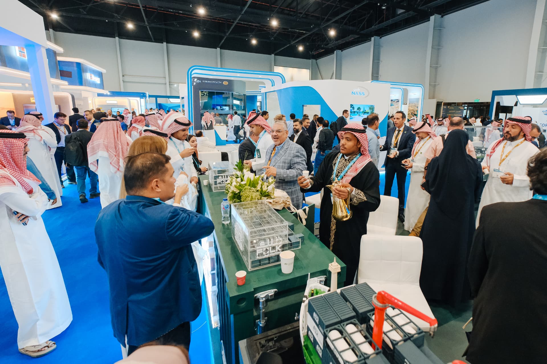 Delegates networking across the exhibition hall